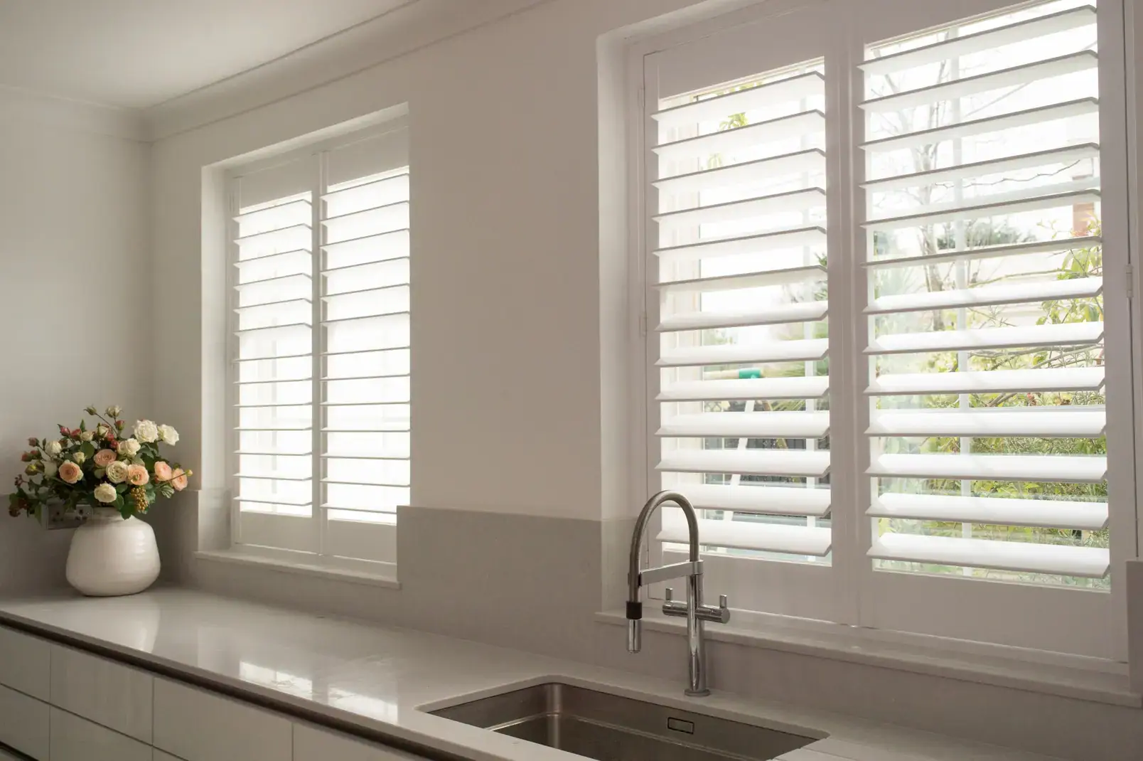 Full Height shutters beside a kitchen sink